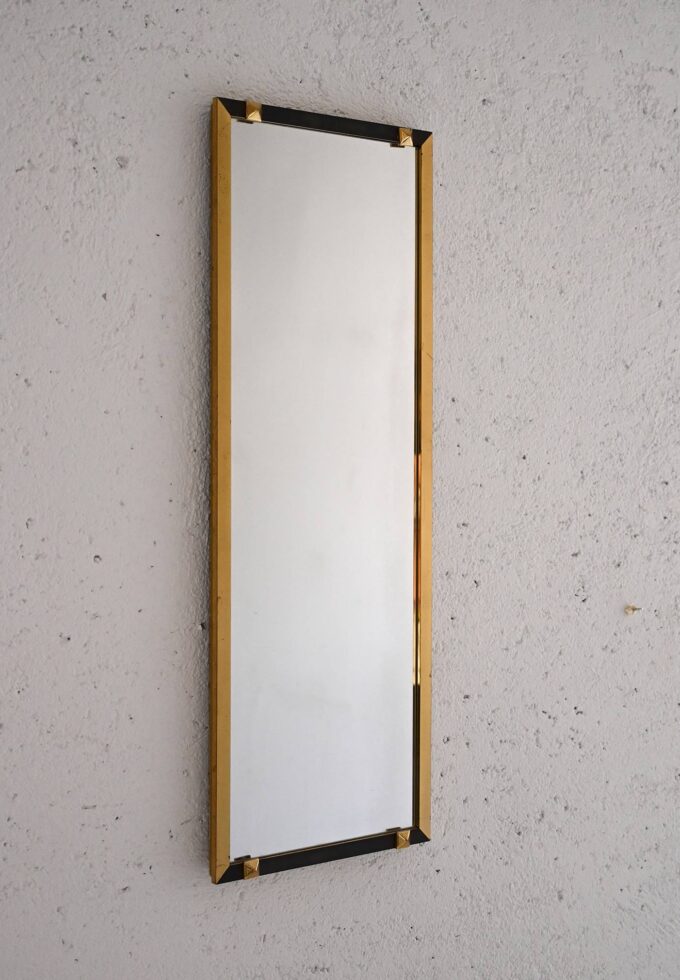 Vintage rectangular mirror with golden and black metal frame
