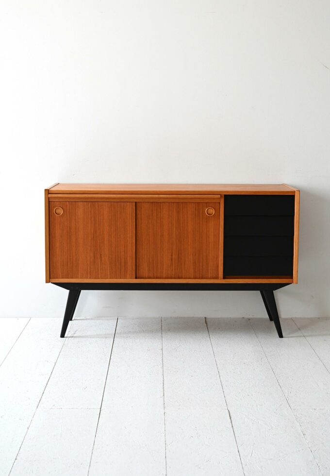 Scandinavian teak sideboard with black-b details.