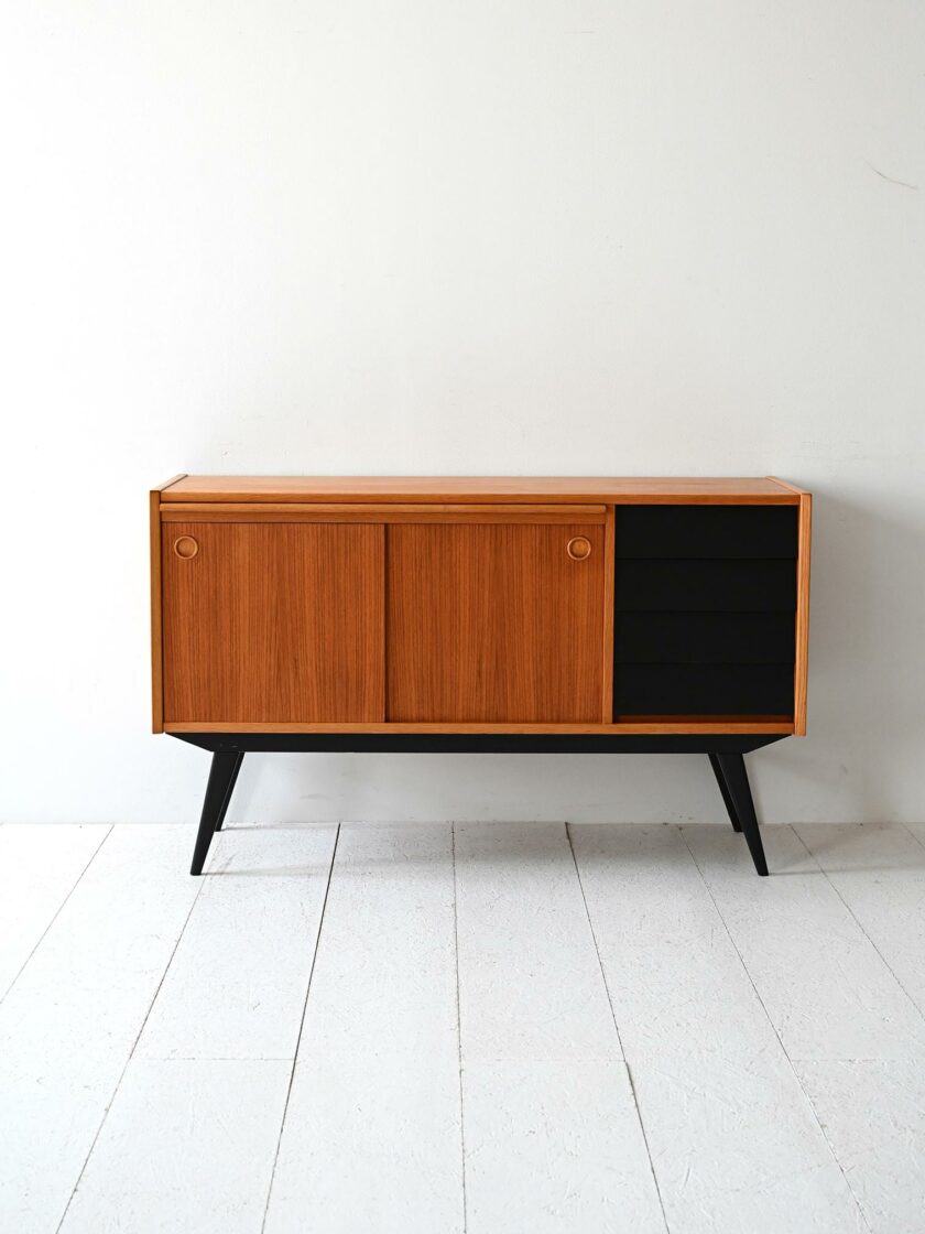 Scandinavian teak sideboard with black-b details.