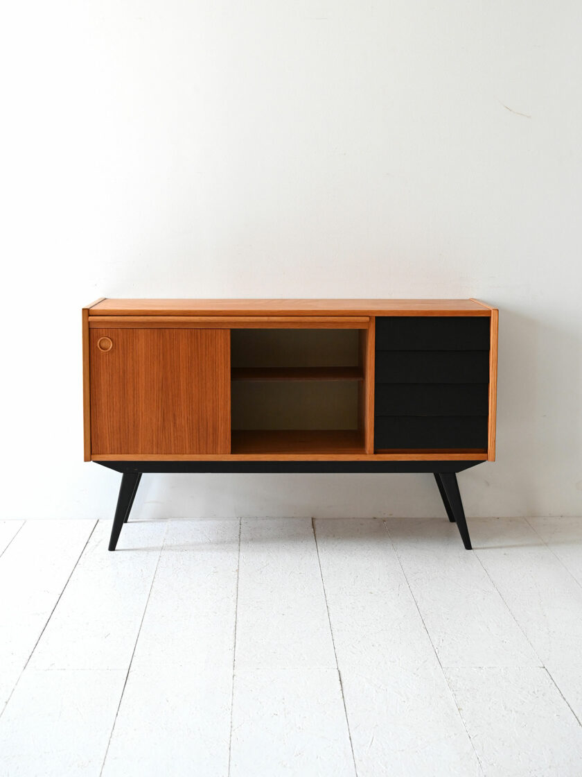 Scandinavian teak sideboard with black-d details.