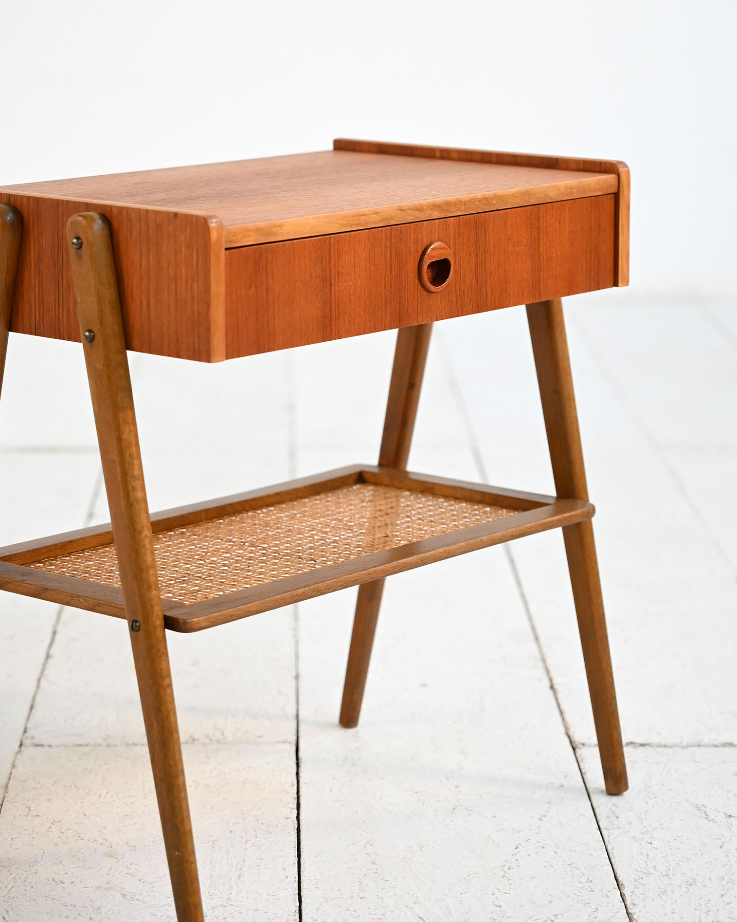 Scandinavian teak bedside table rattan shelf 50s-e Scandinavian teak nightstand with rattan shelf, 1950s-e
