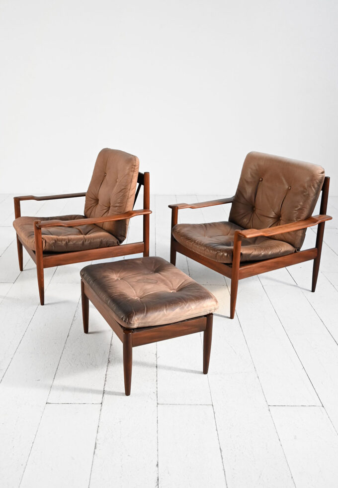Pair of Scandinavian leather poltorne with ottoman, 1960s-c